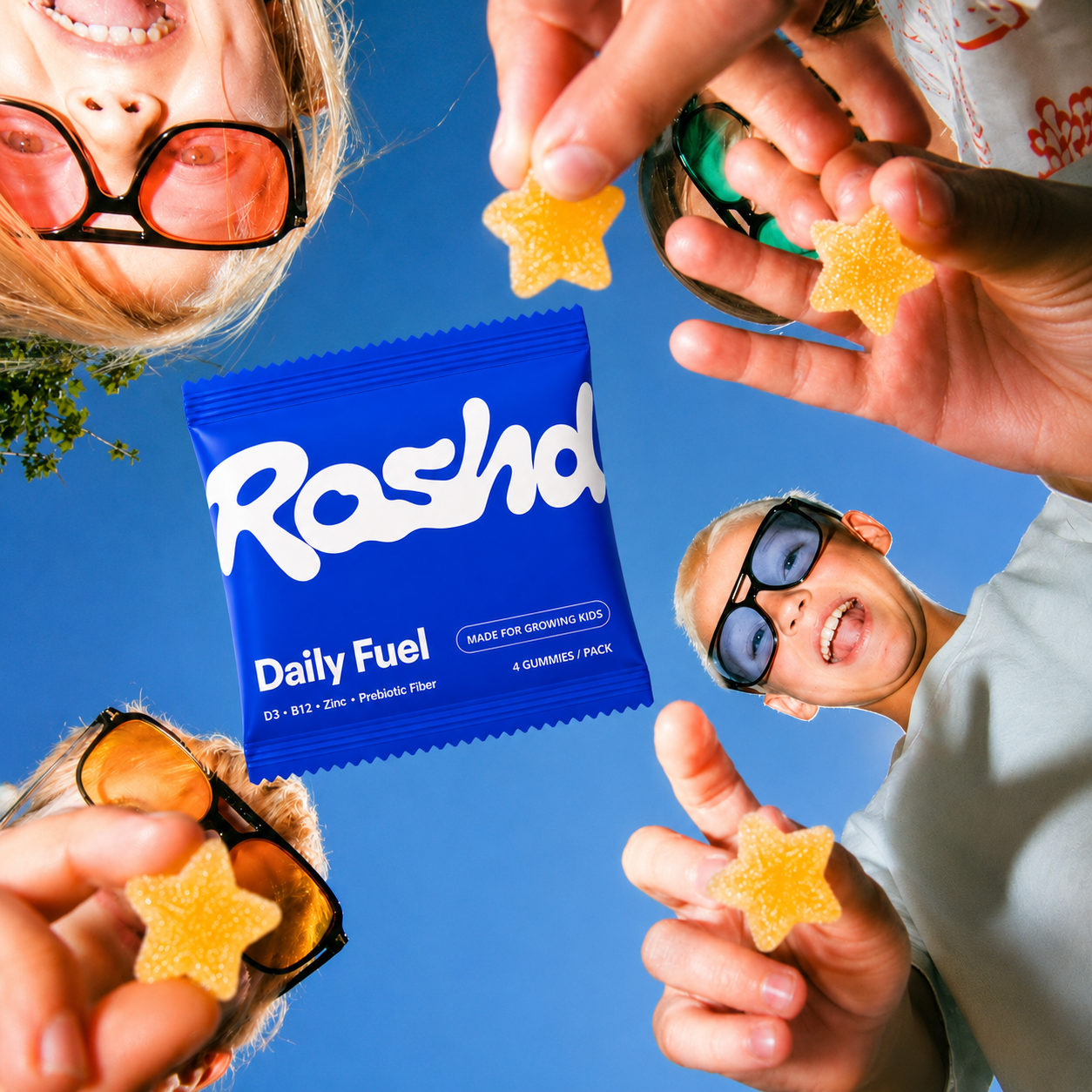 Kids holding Roshd gummies